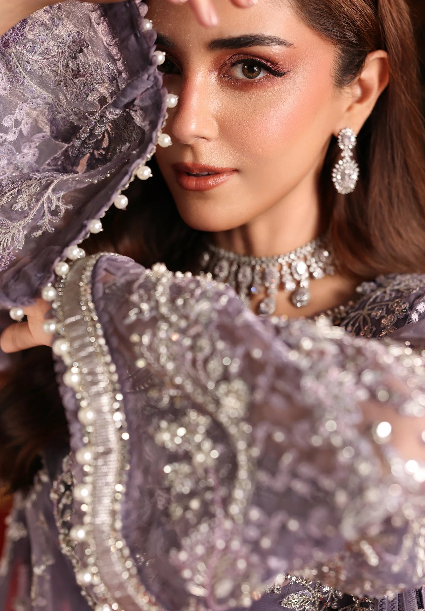 CLOSEUP IMAGE OF EMBROIDERED ORGANZA SLEEVES BORDER.